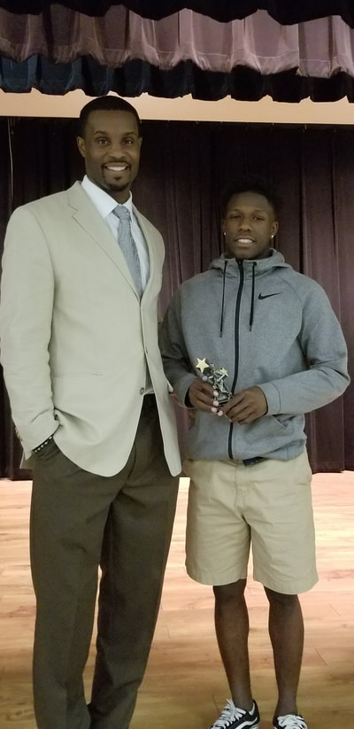 Coach Lewis and Newcomer of the Year Isaiah Lawson